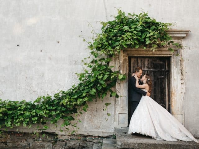 happy bridesmaids are photographed near the old house